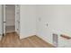 Bright laundry room with wood floors and ample space for appliances at 8347 Golden Beach Ct, Parrish, FL 34219