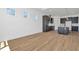 Open space living area with kitchen visible in background, featuring ample space at 8347 Golden Beach Ct, Parrish, FL 34219