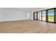 Open concept living space with light floors and glass sliding doors to outdoors at 8347 Golden Beach Ct, Parrish, FL 34219