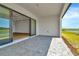 Spacious covered patio with brick pavers overlooking the backyard at 8347 Golden Beach Ct, Parrish, FL 34219