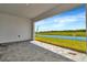 Covered patio featuring brick pavers and a serene water view at 8347 Golden Beach Ct, Parrish, FL 34219