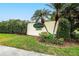 Attractive Villas On The Green 55+ community sign with lush landscaping and well-maintained entrance at 13108 Dobree Pl, Riverview, FL 33579