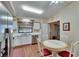 Cozy eat-in kitchen featuring white cabinets and stainless steel appliances at 13108 Dobree Pl, Riverview, FL 33579