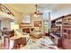 Spacious living room with vaulted ceilings, fireplace, and archway leading to the dining area at 13108 Dobree Pl, Riverview, FL 33579