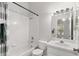 Bright bathroom featuring a shower-tub combo with white tile at 8615 Hunters Key Cir, Tampa, FL 33647