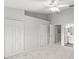 Comfortable bedroom with plush carpeting, closet, and access to bathroom at 8615 Hunters Key Cir, Tampa, FL 33647