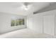 Spacious bedroom featuring a window with natural light and closet storage at 8615 Hunters Key Cir, Tampa, FL 33647