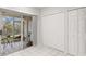 A living area with a screened patio and an adjacent closet at 8615 Hunters Key Cir, Tampa, FL 33647