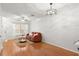 Inviting living room featuring hardwood floors, a comfortable sofa, and a modern ceiling fan at 8615 Hunters Key Cir, Tampa, FL 33647