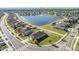 Aerial view of a home near a lake in a sprawling community with easy street access at 9805 Lemon Drop Loop, Sun City Center, FL 33573