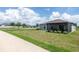 Well-kept backyard with a covered lanai offering a serene outdoor living space at 9805 Lemon Drop Loop, Sun City Center, FL 33573