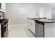 Open kitchen showcases stainless steel appliances, granite counters, and ample storage at 9805 Lemon Drop Loop, Sun City Center, FL 33573