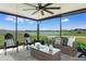 Covered outdoor seating area offers relaxing lake views at 9805 Lemon Drop Loop, Sun City Center, FL 33573