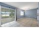 The dining area features tile floors, neutral paint, a modern chandelier, and sliding glass doors to the patio at 10815 Wrigley Ct, Riverview, FL 33579
