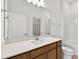 Bathroom features a wood vanity with white countertop and tiled shower at 12660 Glenn Creek Dr, Riverview, FL 33569