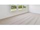 Spacious bedroom boasts plush carpet and bright windows at 12660 Glenn Creek Dr, Riverview, FL 33569