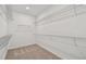 Organized walk-in closet features ample shelving space for clothing and accessories, maximizing storage potential at 12660 Glenn Creek Dr, Riverview, FL 33569