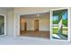 Inviting view from the covered patio shows a modern living room layout with stylish flooring at 12660 Glenn Creek Dr, Riverview, FL 33569
