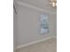 Bedroom features a large window, light tile floor, and a standard closet at 217 Oceania Ct, Apollo Beach, FL 33572