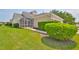 Home exterior with screened porch and green bushes at 217 Oceania Ct, Apollo Beach, FL 33572