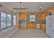 Well-lit kitchen with ample cabinets, granite countertops, and modern appliances, perfect for cooking and entertaining at 217 Oceania Ct, Apollo Beach, FL 33572