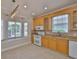 Well-appointed kitchen featuring a window seat, ample cabinets, and modern appliances for a delightful cooking experience at 217 Oceania Ct, Apollo Beach, FL 33572