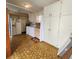 Laundry room featuring cabinets, appliances, and a window for natural light at 2241 Greenwich Dr # 68, Sun City Center, FL 33573