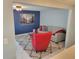 Comfortable living room with stylish blue accent wall, plush seating, and views into a separate living area at 36905 Kay Ave, Zephyrhills, FL 33542