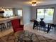 Inviting living room with an open layout, featuring stylish furniture, modern lighting, and sleek, tiled flooring at 36905 Kay Ave, Zephyrhills, FL 33542