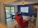 Inviting open-concept living and dining area features modern tile floors and contemporary furnishings at 36905 Kay Ave, Zephyrhills, FL 33542