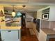 Charming kitchen with vintage lighting, essential appliances, and a breakfast nook, creating a nostalgic cooking space at 37402 Hammond Dr, Zephyrhills, FL 33541