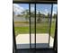 Backyard featuring a patio space and green grass at 4652 Pleasant Ave, Palm Harbor, FL 34683