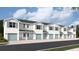 Charming townhomes boast a modern design with light blue doors and shutters at 4652 Pleasant Ave, Palm Harbor, FL 34683