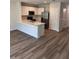 Bright, open kitchen featuring stainless steel appliances and a breakfast bar at 4652 Pleasant Ave, Palm Harbor, FL 34683