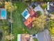 Aerial shot of a property featuring a pool, lush greenery, and a spacious layout, showcasing its outdoor appeal at 5101 Oakhaven Ln, Temple Terrace, FL 33617