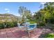 Outdoor seating area offers a peaceful view of the fenced in yard and screened in pool at 5101 Oakhaven Ln, Temple Terrace, FL 33617