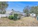 Spacious backyard with enclosed swimming pool, patio and detached storage shed at 6009 County Line Rd, Spring Hill, FL 34606