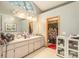 Bathroom showcasing double sinks, large vanity, cabinets, and decorative lighting at 6009 County Line Rd, Spring Hill, FL 34606