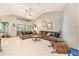 Open living room with high ceilings, tile floors, and neutral paint, creating a bright and inviting space at 6009 County Line Rd, Spring Hill, FL 34606