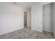 Cozy bedroom with plush neutral carpet, closet, and entrance to another room providing versatile options at 6212 Broad Field Ave, Apollo Beach, FL 33572