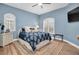 Comfortable bedroom with hardwood floors, stylish furnishings, and natural light at 6224 Vista Verde W Dr, St Petersburg, FL 33707