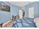 Relaxing bedroom with a desk, television, and access to other rooms at 6224 Vista Verde W Dr, St Petersburg, FL 33707