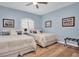 Bright bedroom with two twin beds, hardwood floors, and stylish decor at 6224 Vista Verde W Dr, St Petersburg, FL 33707