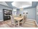 Bright dining room with elegant chandelier, artwork, and buffet cabinet at 6224 Vista Verde W Dr, St Petersburg, FL 33707