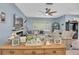 Bright living room with fireplace, ceiling fan, plenty of natural light, and neutral furniture and decor at 6224 Vista Verde W Dr, St Petersburg, FL 33707