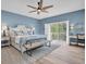 Spacious main bedroom features ceiling fan, luxury vinyl floors, and sliding glass door to the lanai at 6224 Vista Verde W Dr, St Petersburg, FL 33707
