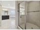 Bright primary bathroom with large dark vanity, separate shower and tub at 10825 Charmwood Dr, Riverview, FL 33569