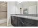 Bathroom with a granite countertop vanity, cabinets, and a shower/tub combination at 10825 Charmwood Dr, Riverview, FL 33569