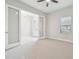 Bright and airy bedroom with two large windows, a ceiling fan and neutral-colored walls at 10825 Charmwood Dr, Riverview, FL 33569