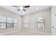 Well-lit bedroom with carpet flooring, windows, and neutral paint at 10825 Charmwood Dr, Riverview, FL 33569